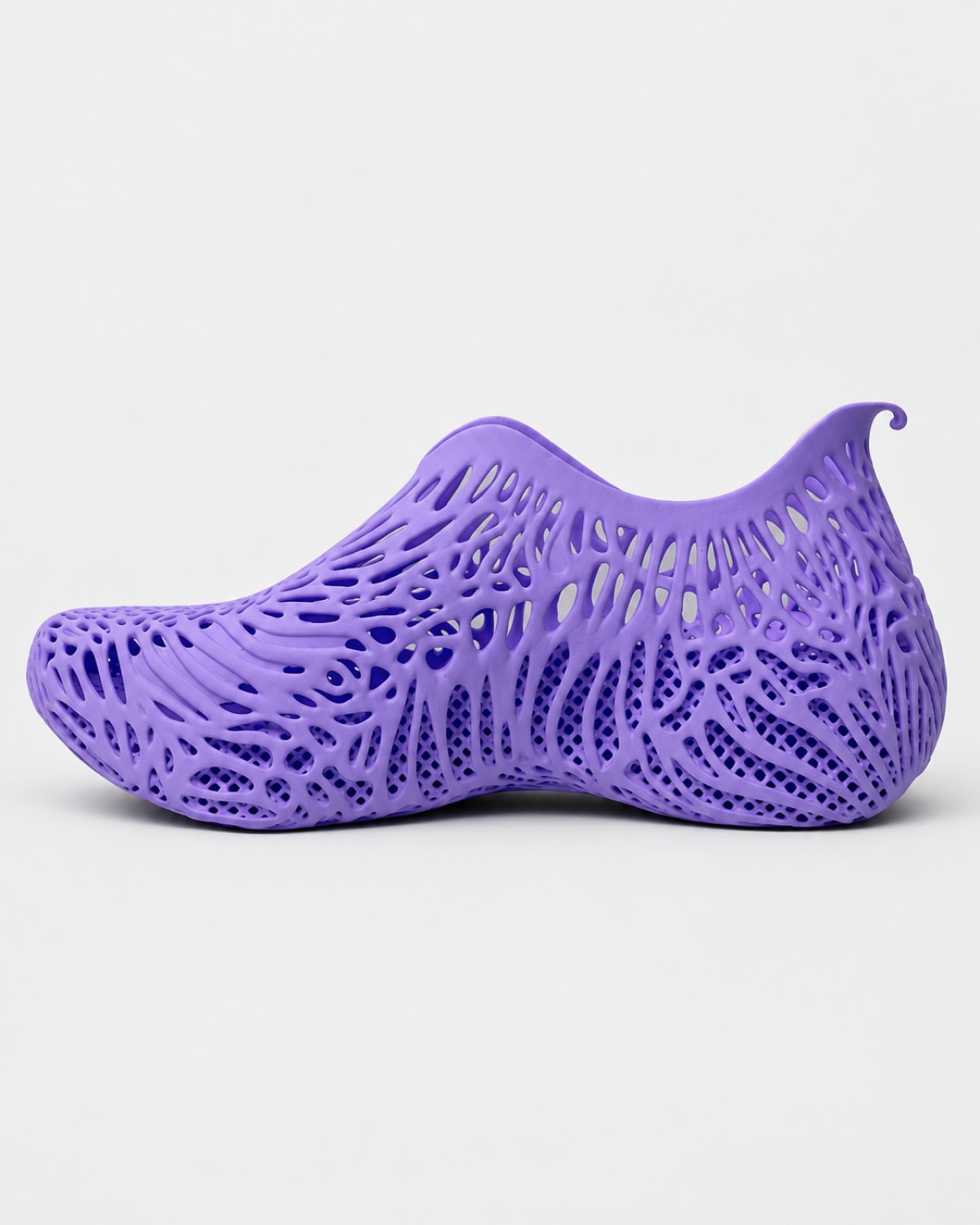 A single purple water shoe with an intricate, open-foam lattice pattern, shown in profile against a light gray background.